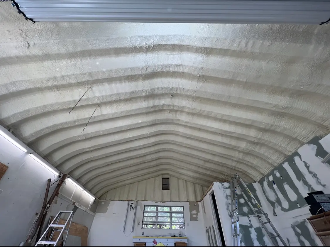 Spray polyurethane foam applied to the underside of a metal roof deck in Fife